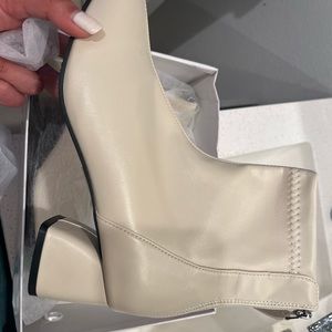 Brand new cute heeled boots. Heel is about 0.5-1 inch
